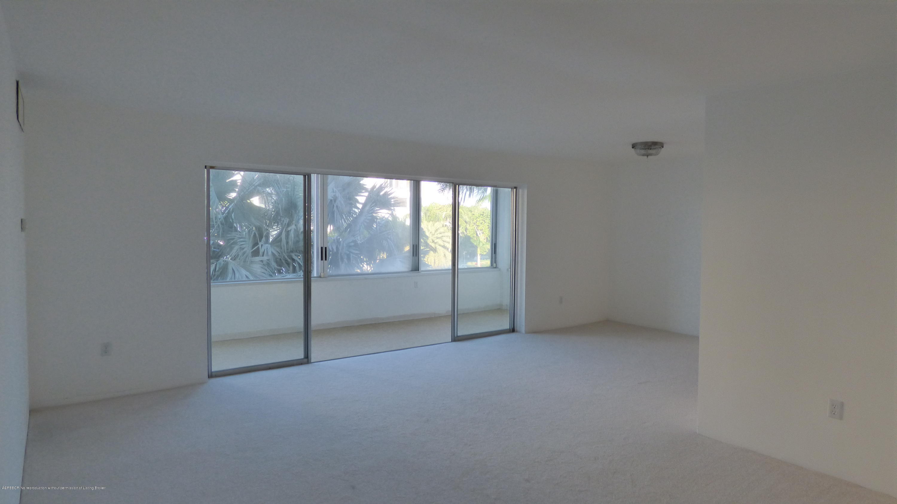 44 Cocoanut Row, Unit 308B Palm Beach, FL 33480 - Photo 2 of 14 a view of an empty room with glass door and balcony