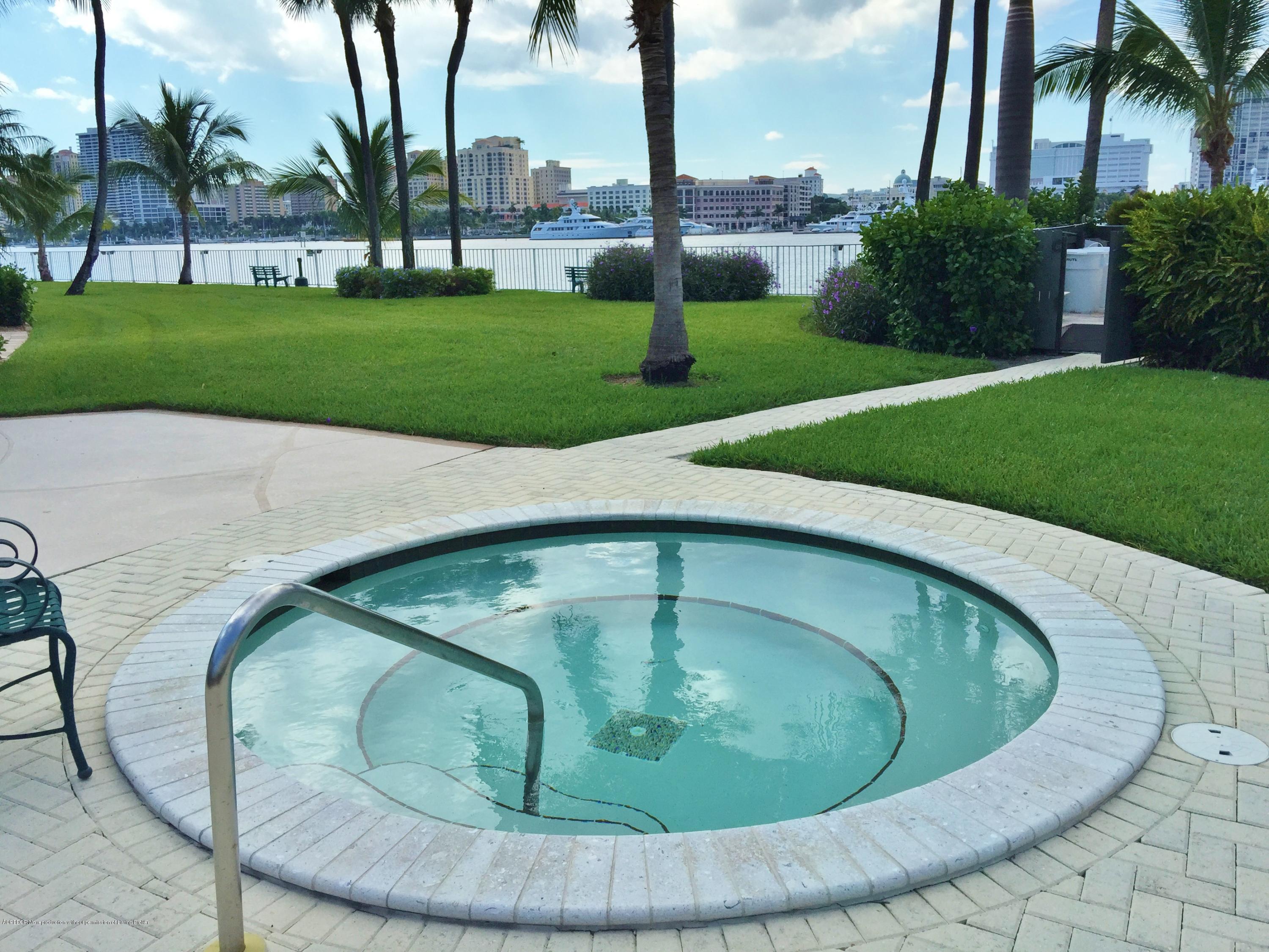 44 Cocoanut Row, Unit 308B Palm Beach, FL 33480 - Photo 12 of 14 a view of a swimming pool with a yard