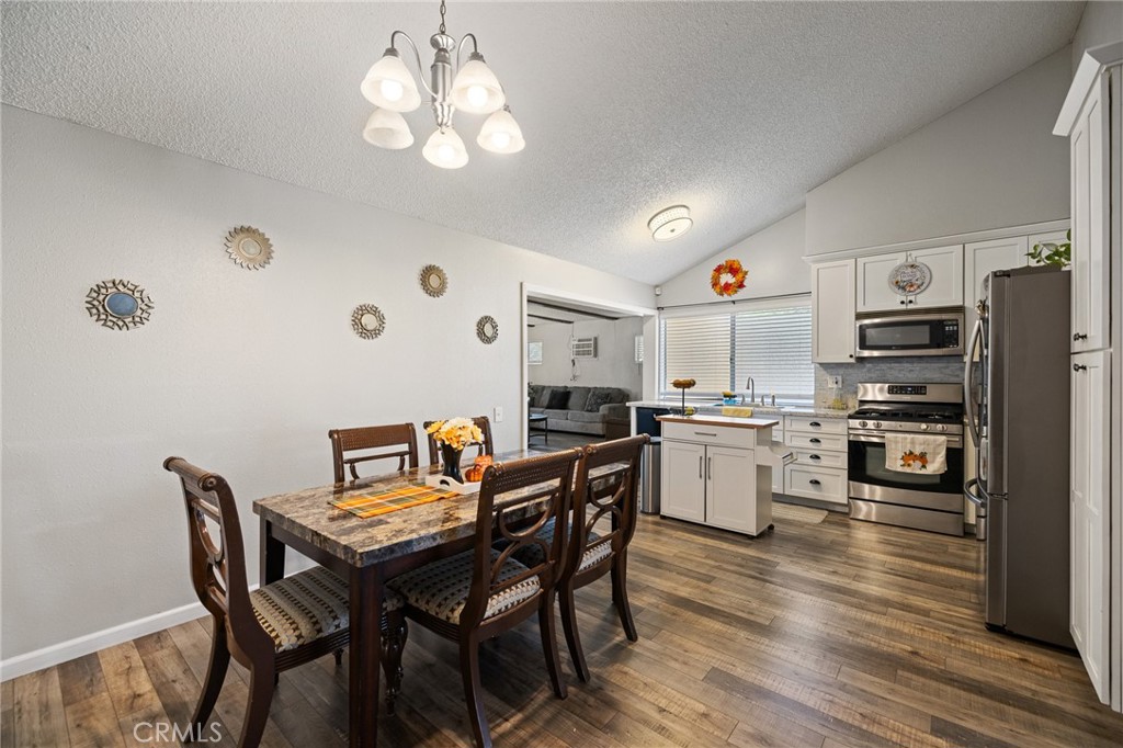638 Eston Place Lancaster, CA 93535 - Photo 12 of 44 a kitchen that has a table and chairs in it