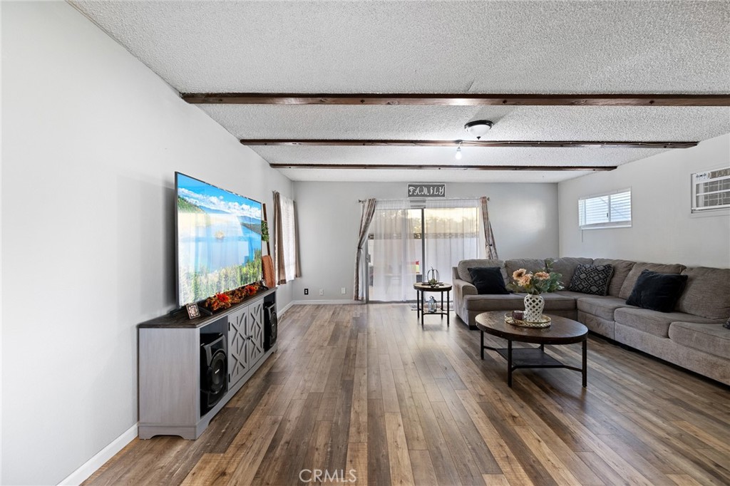 638 Eston Place Lancaster, CA 93535 - Photo 16 of 44 a living room with furniture and a flat screen tv