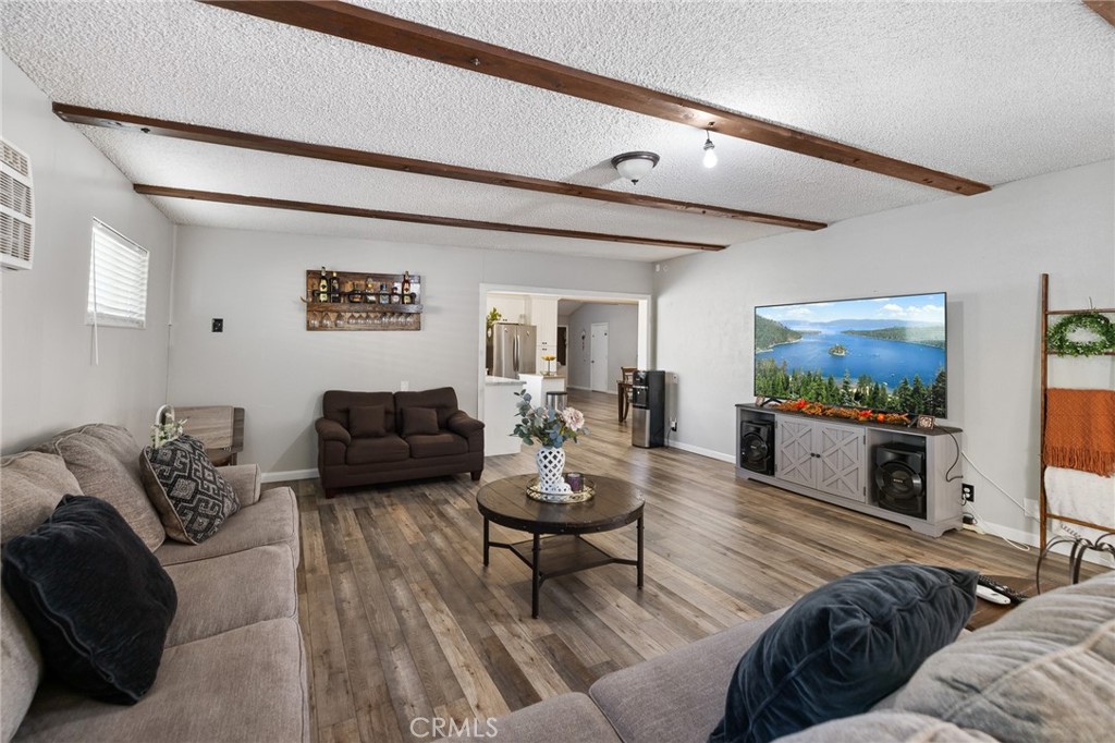 638 Eston Place Lancaster, CA 93535 - Photo 18 of 44 a living room with furniture and a flat screen tv