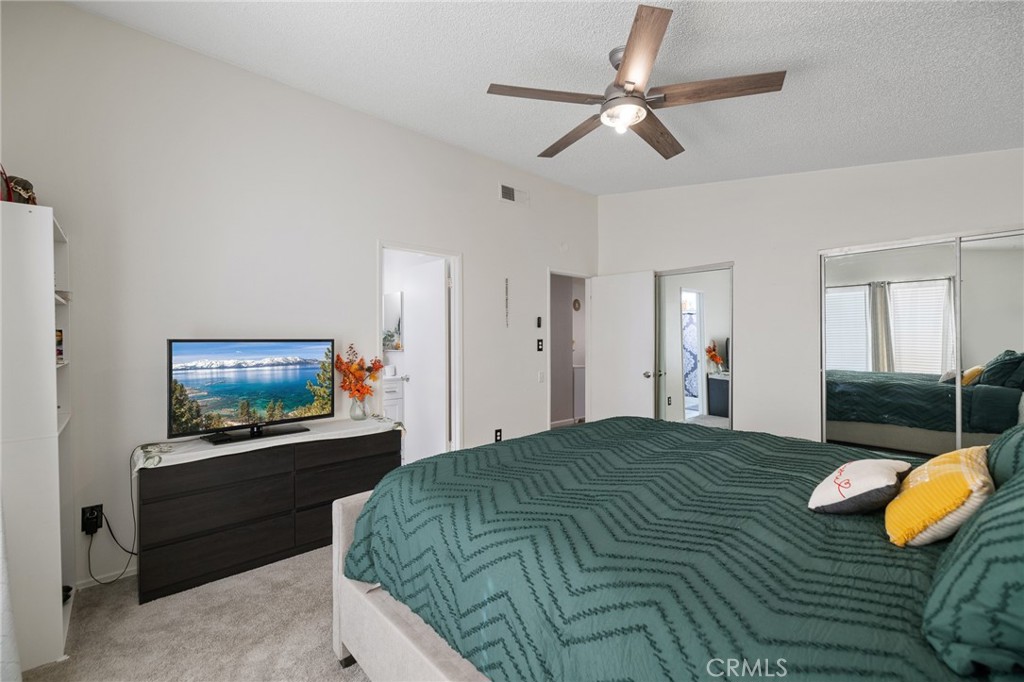 638 Eston Place Lancaster, CA 93535 - Photo 22 of 44 a bedroom with a bed and a flat screen tv