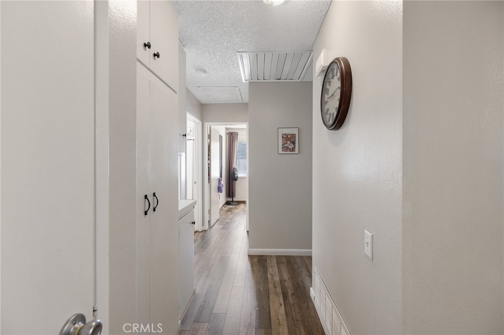 638 Eston Place Lancaster, CA 93535 - Photo 24 of 44 a view of a hallway with wooden floor