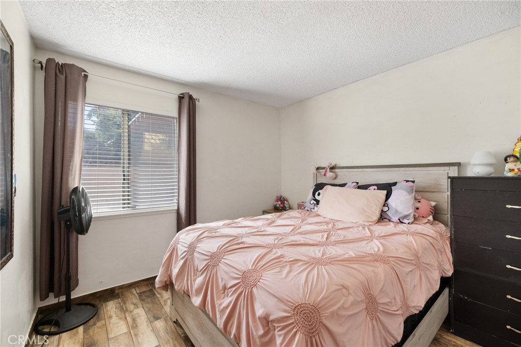 638 Eston Place Lancaster, CA 93535 - Photo 29 of 44 a bedroom with a bed and a window