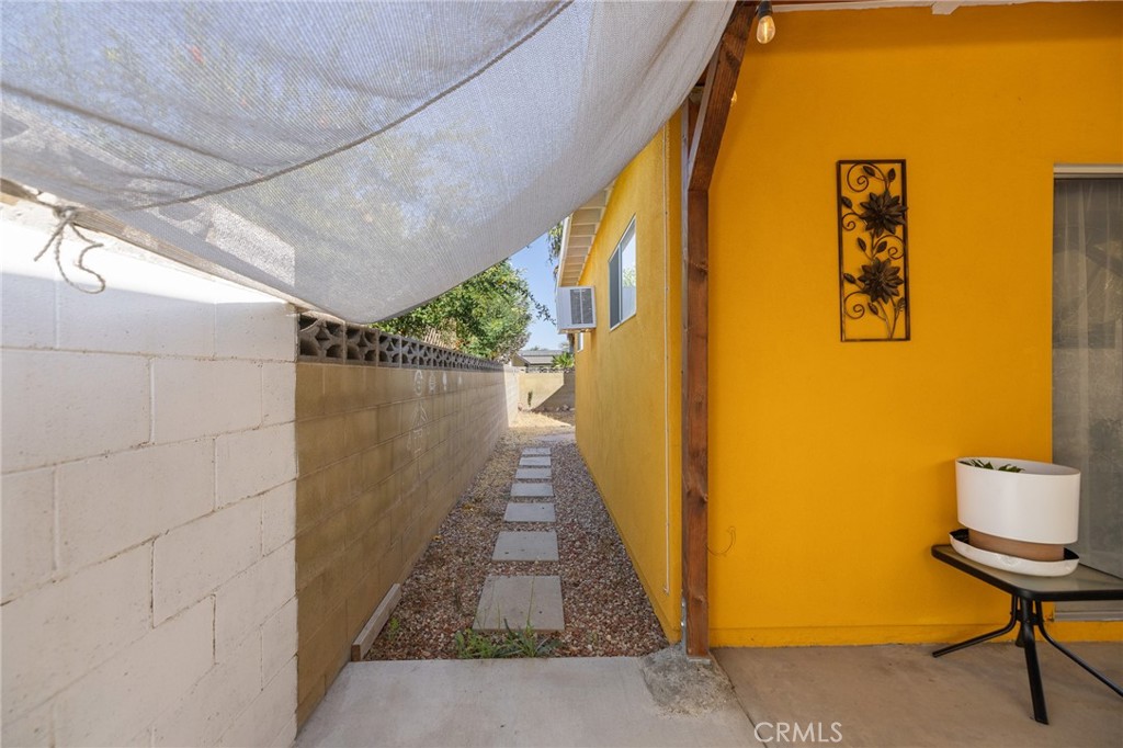 638 Eston Place Lancaster, CA 93535 - Photo 39 of 44 a view of a patio door and an outdoor space