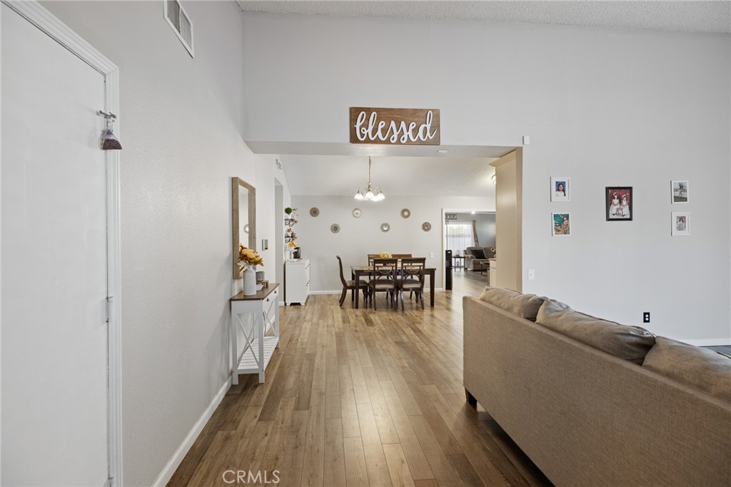 638 Eston Place Lancaster, CA 93535 - Photo 4 of 44 a living room with furniture and wooden floor