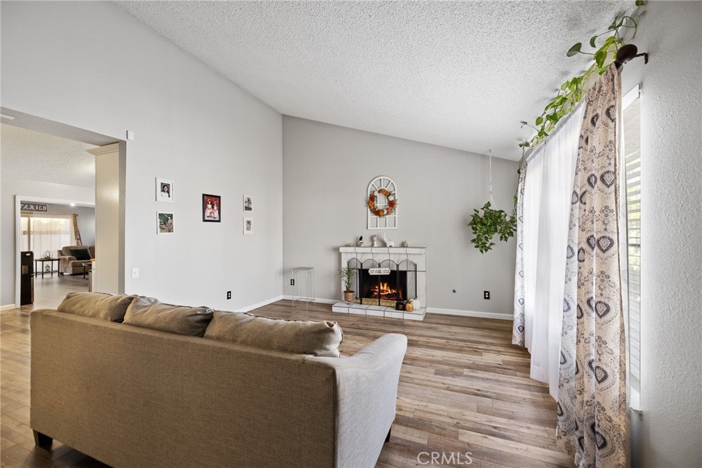 638 Eston Place Lancaster, CA 93535 - Photo 5 of 44 a living room with furniture and a fireplace