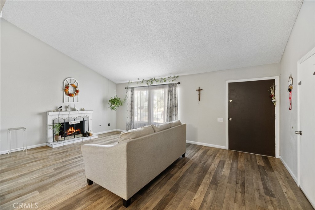 638 Eston Place Lancaster, CA 93535 - Photo 7 of 44 a living room with furniture and a fireplace