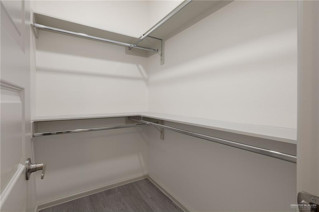 740 North Alamo Road, Unit 2 Alamo, TX 78516 - Photo 13 of 24 a view of a room with racks on the wall