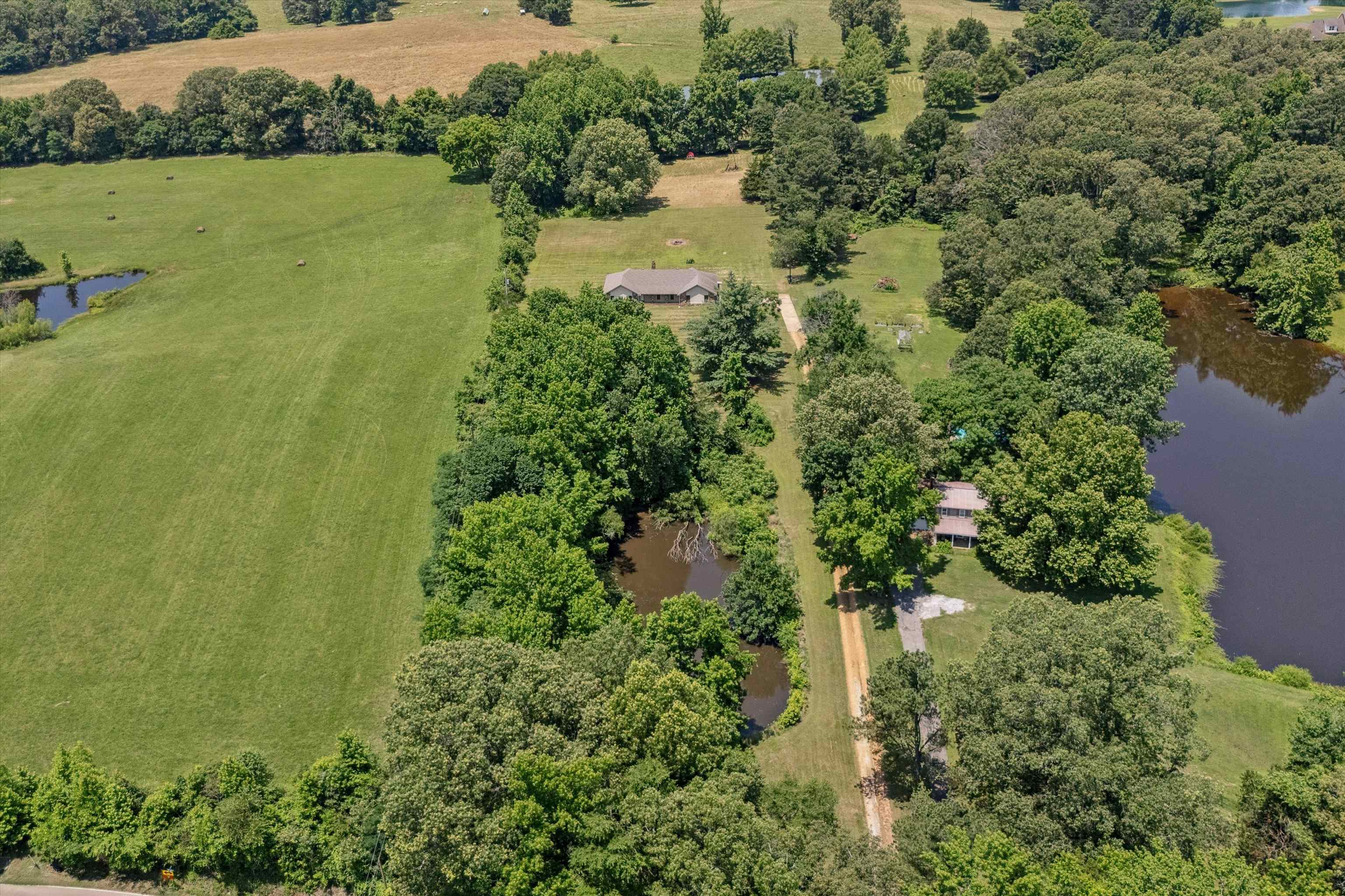 8783 Deadfall Road Millington, TN 38053 - Photo 18 of 27 Overview of rural landscape featuring a nearby body of water