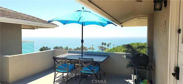 a view of a balcony with an ocean view