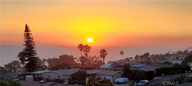 a view of a ocean with a mountain