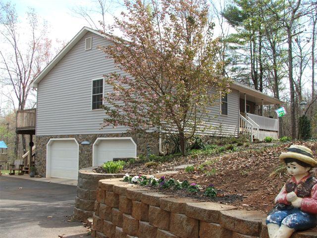 260 Mallard Point Road Wirtz, VA 24184 - Photo 2 of 7 a front view of a house with garden