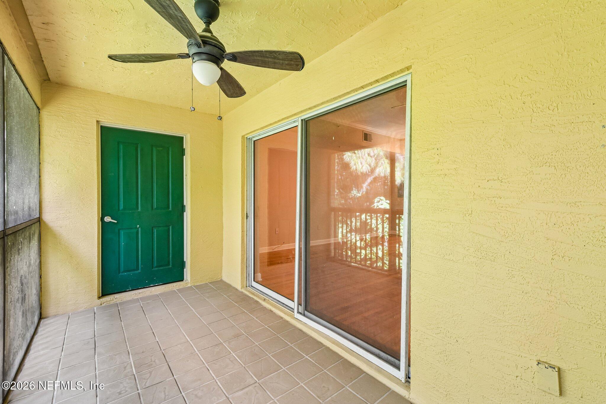 9745 Touchton Road, Unit 1129 Jacksonville, FL 32246 - Photo 40 of 57 Sliders from Living Room to Lanai