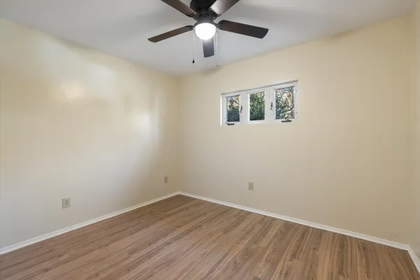 a view of a house with backyard and garden