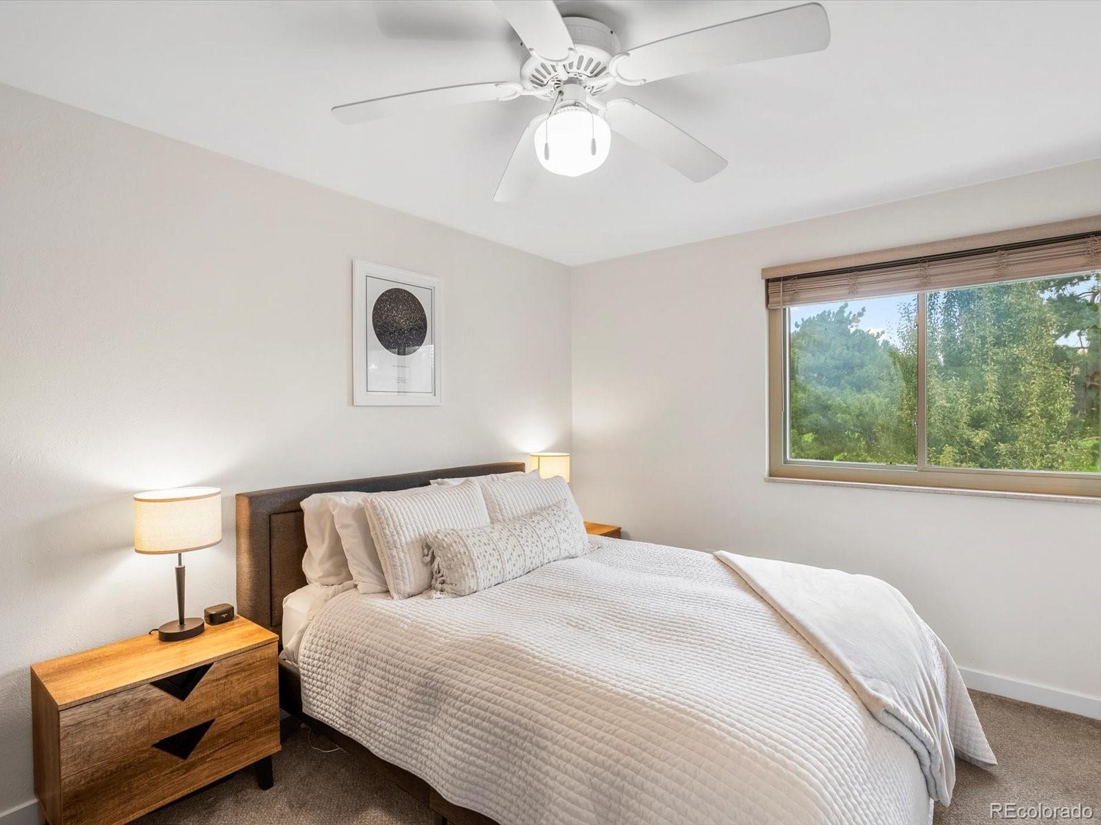 8324 Everett Way Arvada, CO 80005 - Photo 12 of 39 a bedroom with a bed and a window