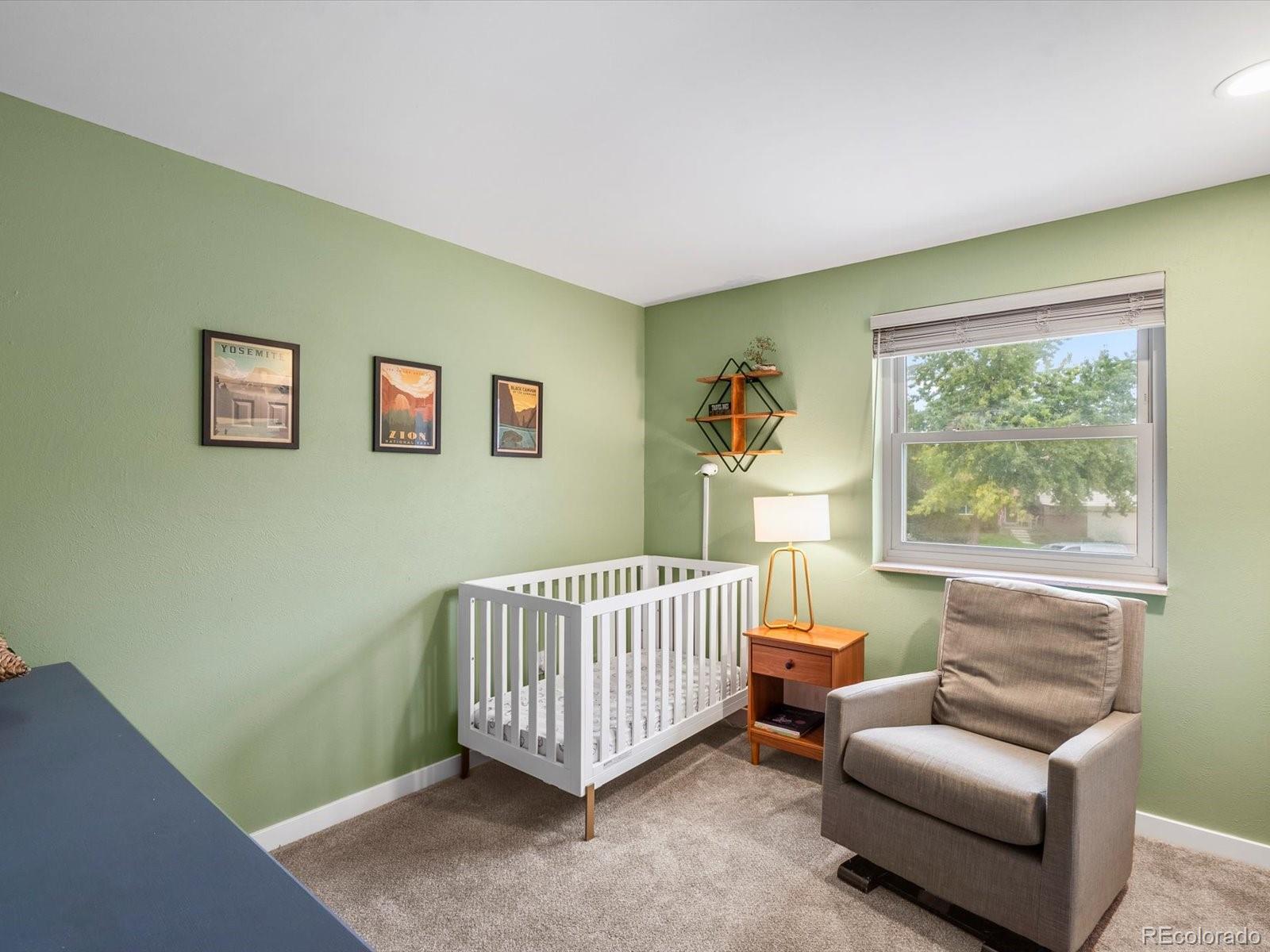 8324 Everett Way Arvada, CO 80005 - Photo 14 of 39 a room with furniture and a window