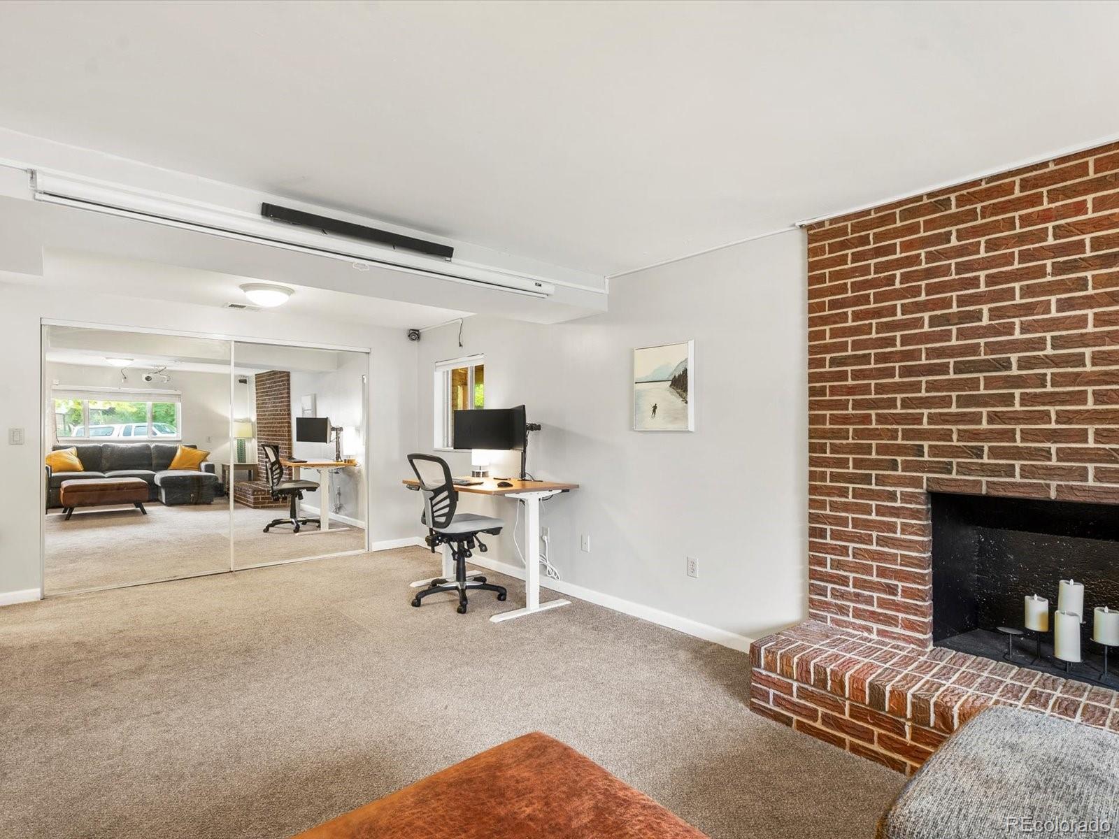 8324 Everett Way Arvada, CO 80005 - Photo 20 of 39 a view of a livingroom with furniture and a fireplace