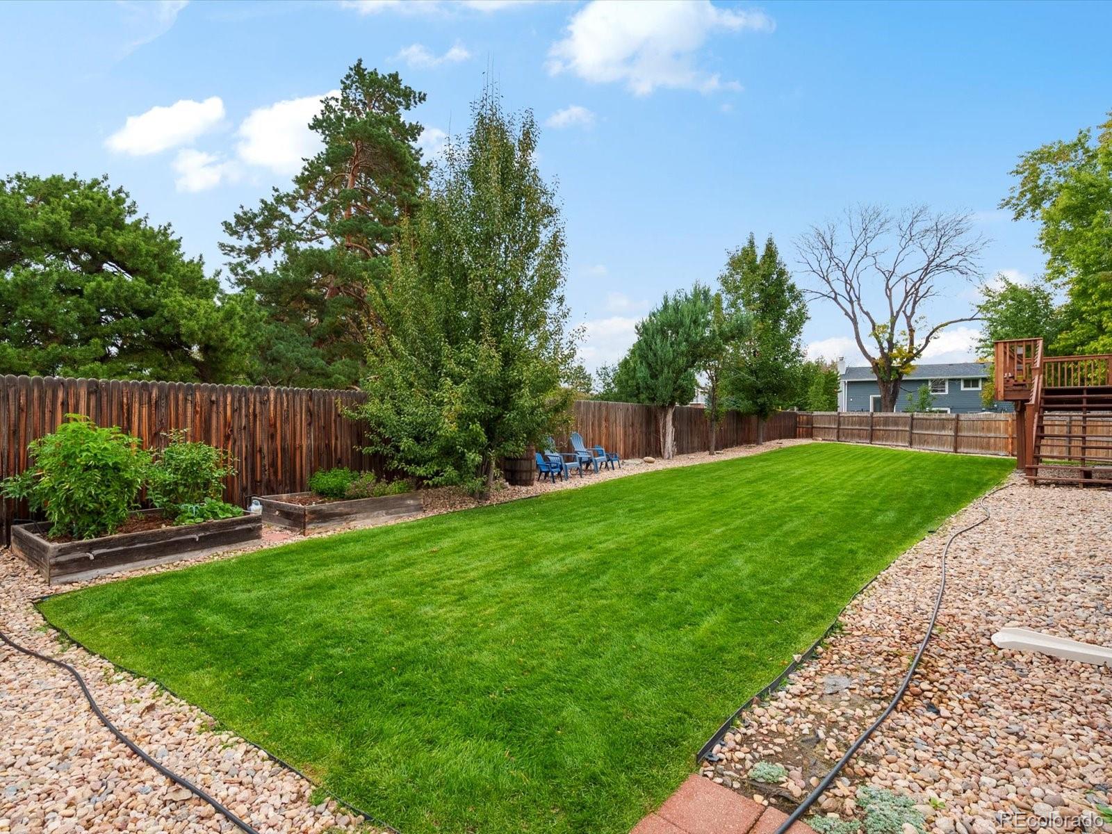 8324 Everett Way Arvada, CO 80005 - Photo 2 of 39 a view of a backyard with a garden