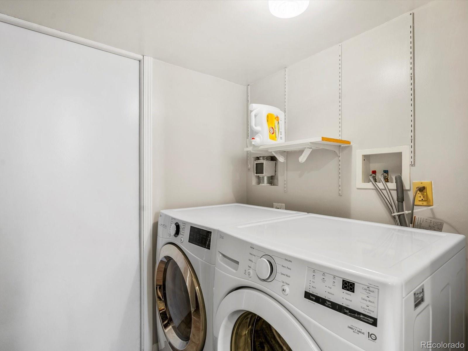 8324 Everett Way Arvada, CO 80005 - Photo 23 of 39 a utility room with dryer and washer