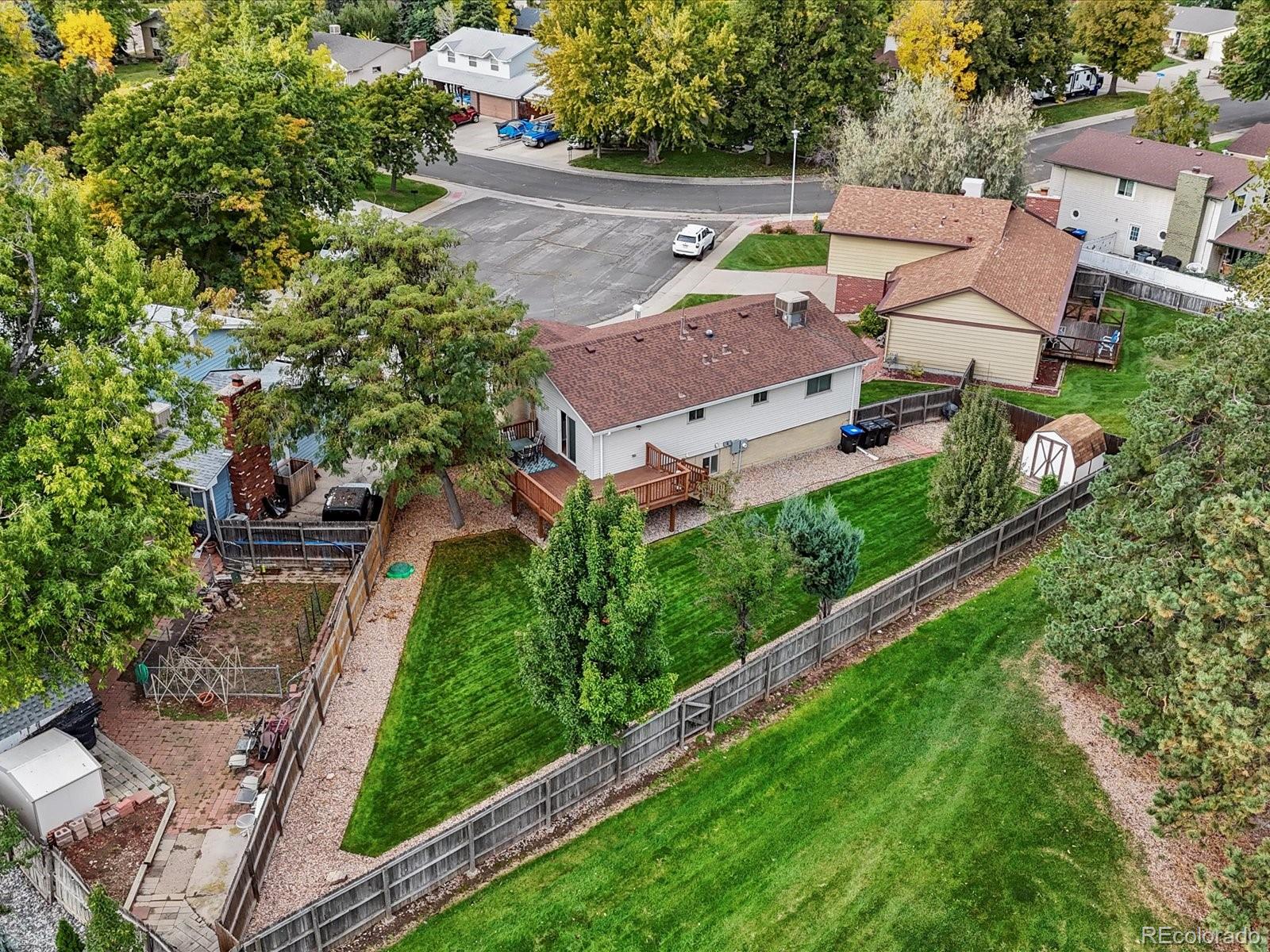 8324 Everett Way Arvada, CO 80005 - Photo 25 of 39 an aerial view of multiple houses with yard