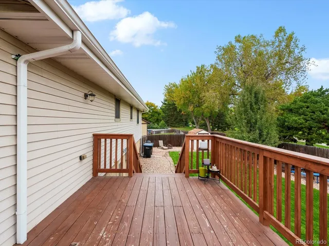 a view of balcony with deck and wooden floor