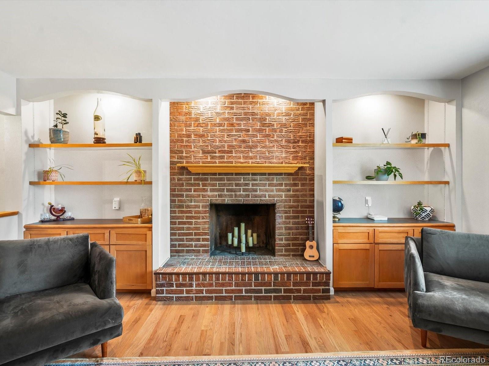 8324 Everett Way Arvada, CO 80005 - Photo 6 of 39 a living room with furniture and a fireplace