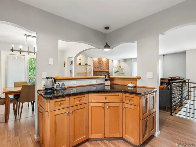 a kitchen with stainless steel appliances a sink and cabinets