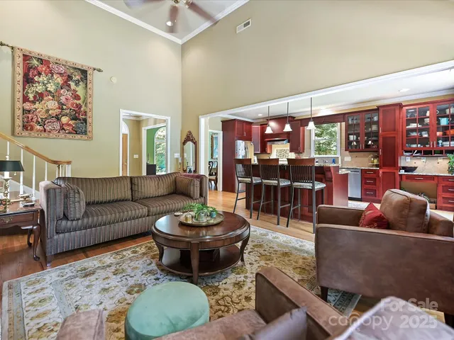 a living room with furniture a rug and a flat screen tv