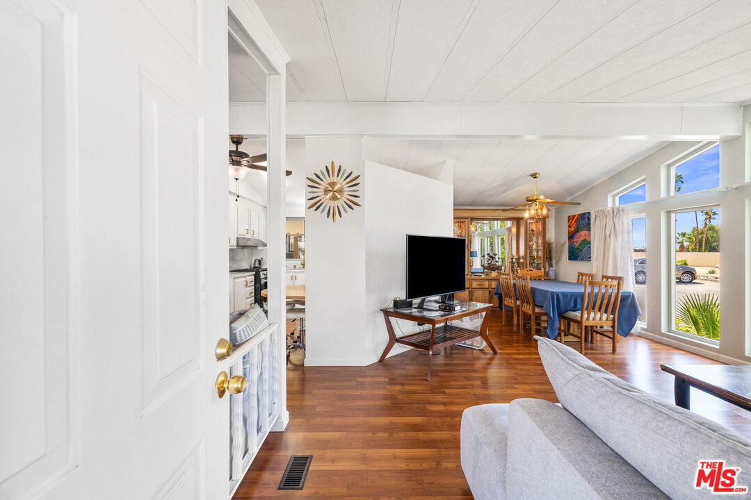 74711 Dillon Road, Unit 503 Desert Hot Springs, CA 92241 - Photo 11 of 52 a living room with furniture and a flat screen tv