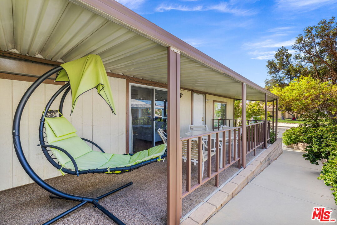 74711 Dillon Road, Unit 503 Desert Hot Springs, CA 92241 - Photo 24 of 52 a view of a couches with wooden fence