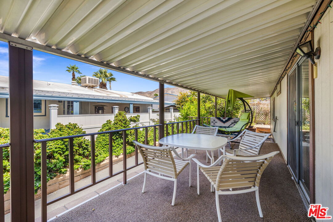 74711 Dillon Road, Unit 503 Desert Hot Springs, CA 92241 - Photo 26 of 52 a view of a dining room with furniture window and outside view