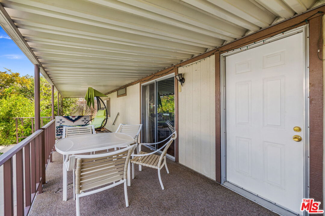74711 Dillon Road, Unit 503 Desert Hot Springs, CA 92241 - Photo 27 of 52 a patio with table and chairs