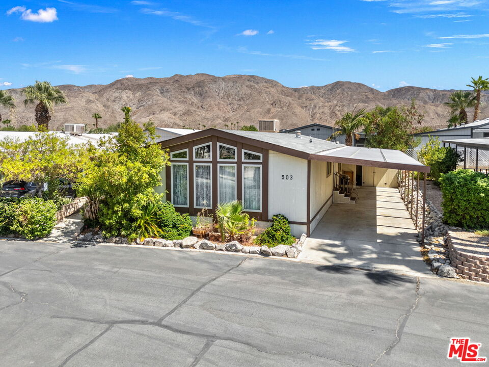 74711 Dillon Road, Unit 503 Desert Hot Springs, CA 92241 - Photo 4 of 52 front view of house with a street