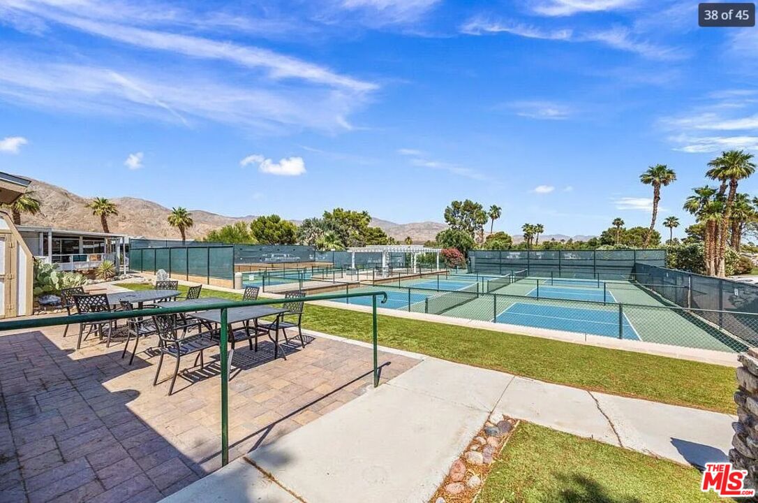 74711 Dillon Road, Unit 503 Desert Hot Springs, CA 92241 - Photo 41 of 52 a view of a swimming pool with seating space