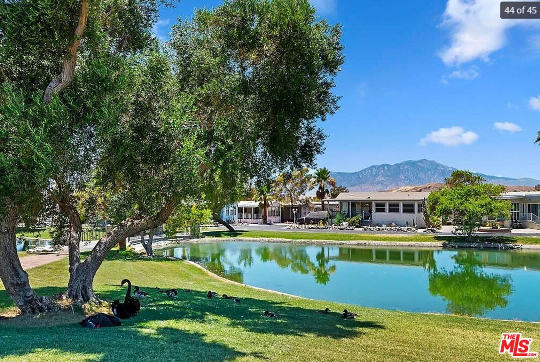 74711 Dillon Road, Unit 503 Desert Hot Springs, CA 92241 - Photo 44 of 52 a view of a lake with houses