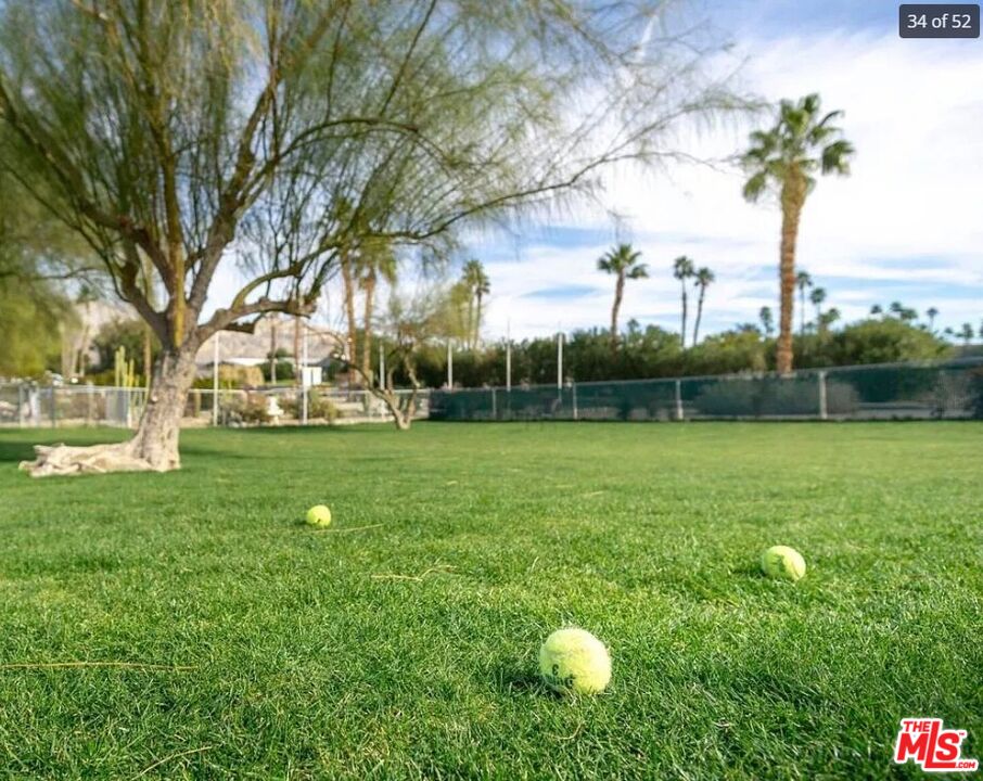 74711 Dillon Road, Unit 503 Desert Hot Springs, CA 92241 - Photo 49 of 52 a view of yard with swimming pool and green space