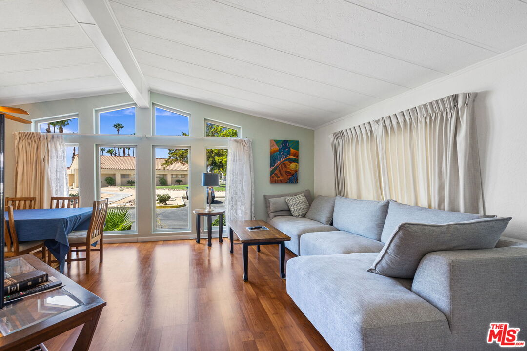 74711 Dillon Road, Unit 503 Desert Hot Springs, CA 92241 - Photo 5 of 52 a living room with furniture and wooden floor