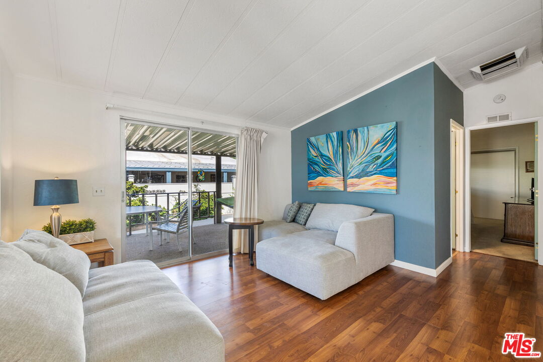 74711 Dillon Road, Unit 503 Desert Hot Springs, CA 92241 - Photo 8 of 52 a living room with furniture and a flat screen tv