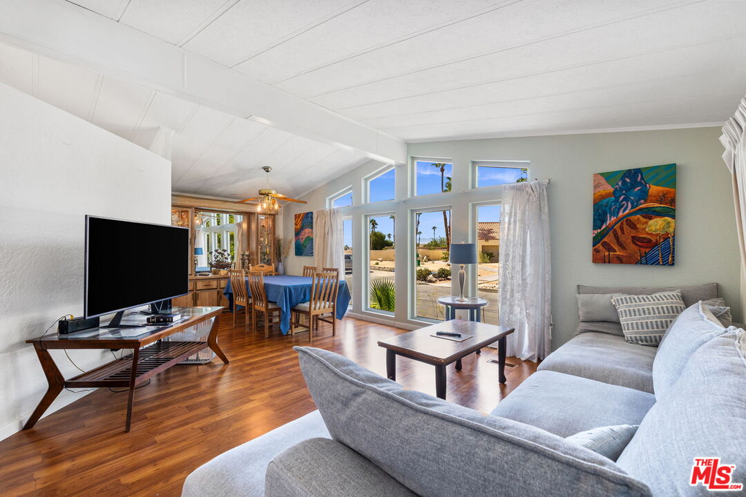 74711 Dillon Road, Unit 503 Desert Hot Springs, CA 92241 - Photo 9 of 52 a living room with furniture and a flat screen tv