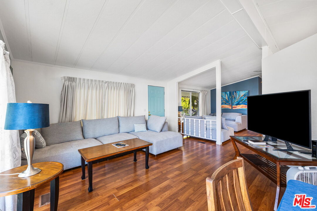 74711 Dillon Road, Unit 503 Desert Hot Springs, CA 92241 - Photo 10 of 52 a living room with furniture and a flat screen tv