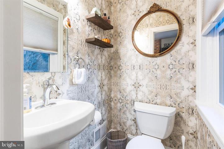 419 North Olive Street Media, PA 19063 - Photo 15 of 31 a bathroom with a toilet sink and mirror