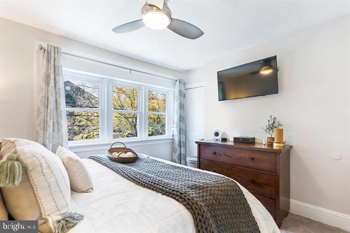 419 North Olive Street Media, PA 19063 - Photo 22 of 31 a bedroom with a bed and a flat screen tv