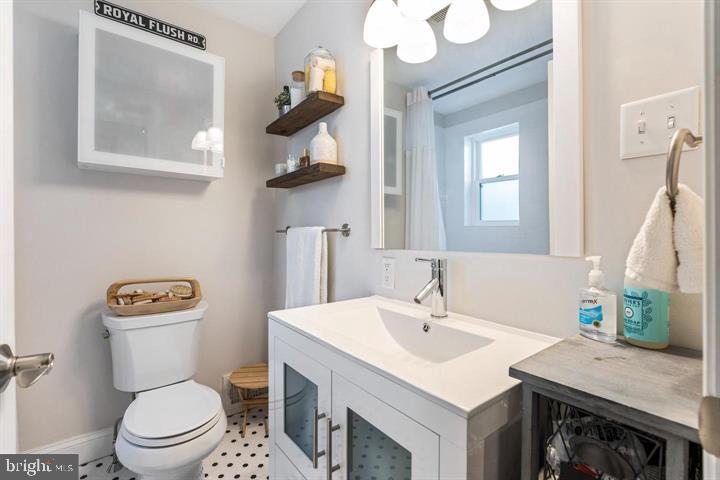 419 North Olive Street Media, PA 19063 - Photo 24 of 31 a bathroom with a toilet a sink and mirror