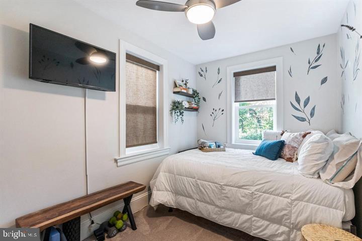 419 North Olive Street Media, PA 19063 - Photo 28 of 31 a bedroom with a bed window and a chandelier