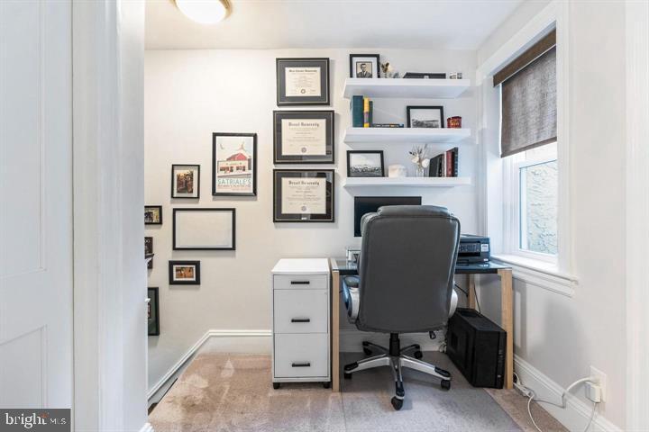 419 North Olive Street Media, PA 19063 - Photo 29 of 31 a view of a workspace with furniture and a bookshelf