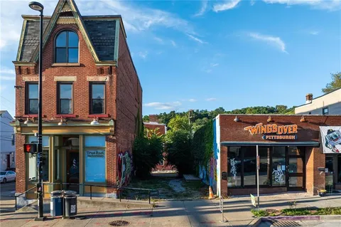a view of multiple houses with outdoor space