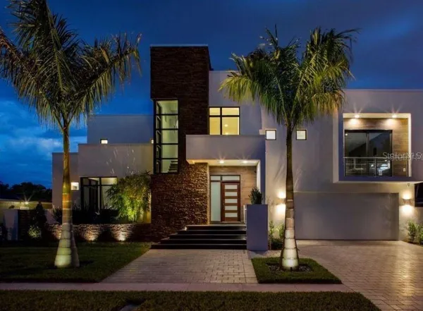 a front view of a house with yard