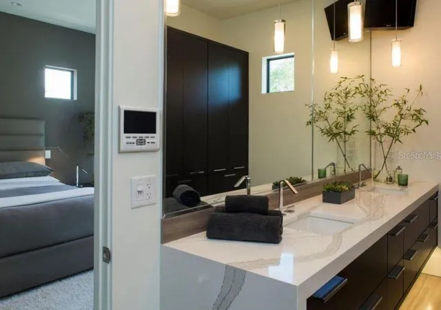 a bathroom with a sink and a mirror