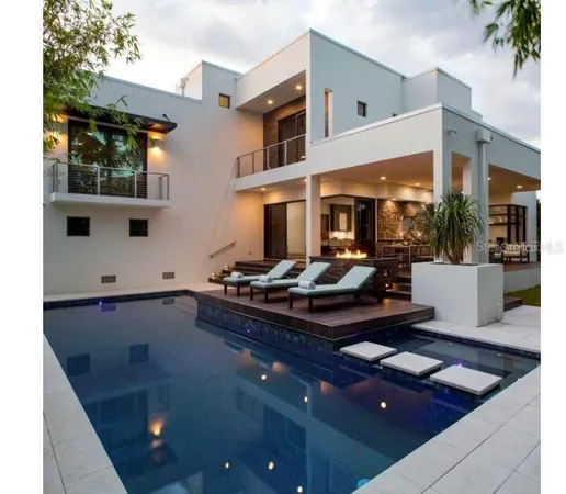a room with furniture pool table and flat screen tv